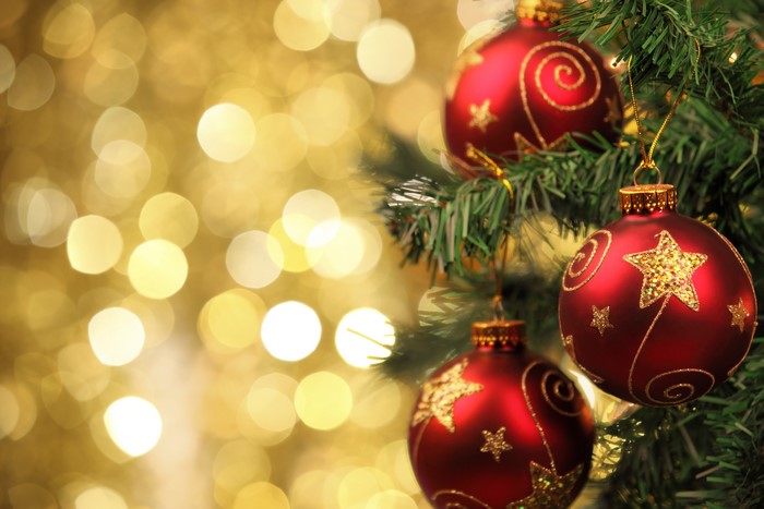 Christmas ornaments on a tree with bokeh lights