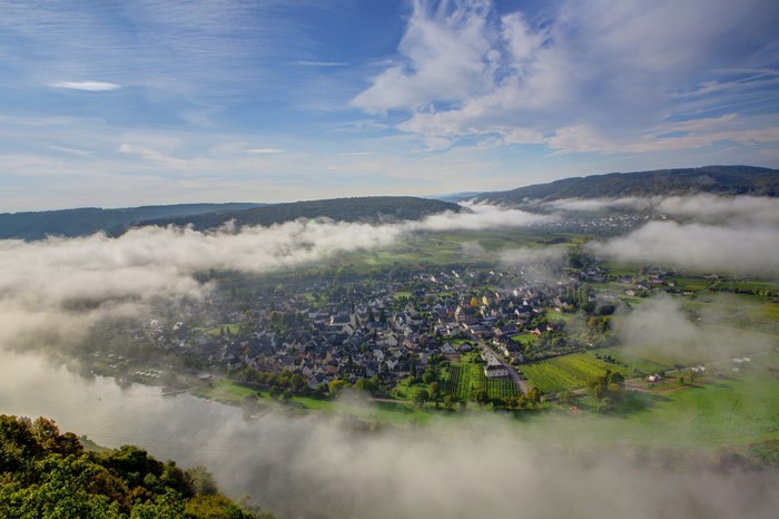 Aerial view of Zell, Germany with fog over the Moselle River