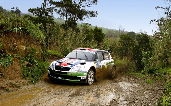 Skoda Fabia rally car driving through mud