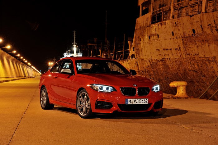 Red BMW M235i F22 parked at night