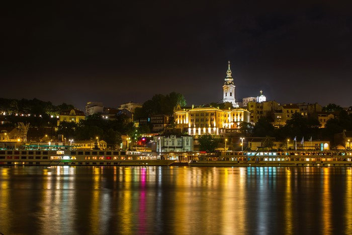 Belgrade cityscape at night with river reflections