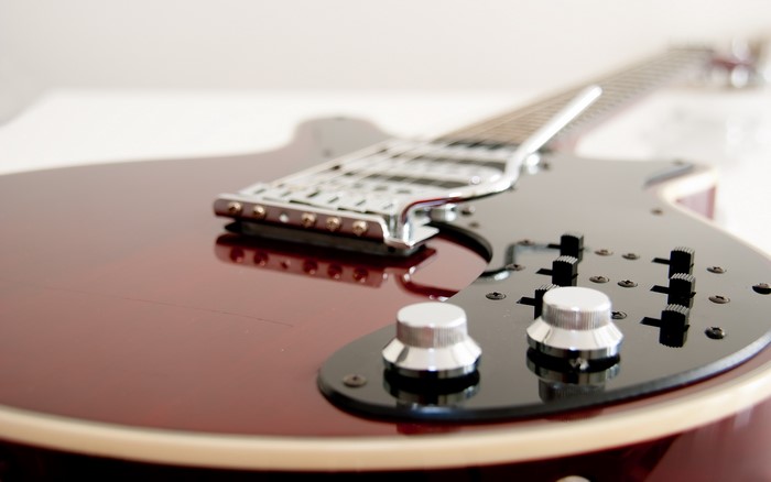 Close-up of a red electric guitar