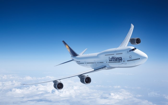 Lufthansa Boeing 747-8 flying above clouds