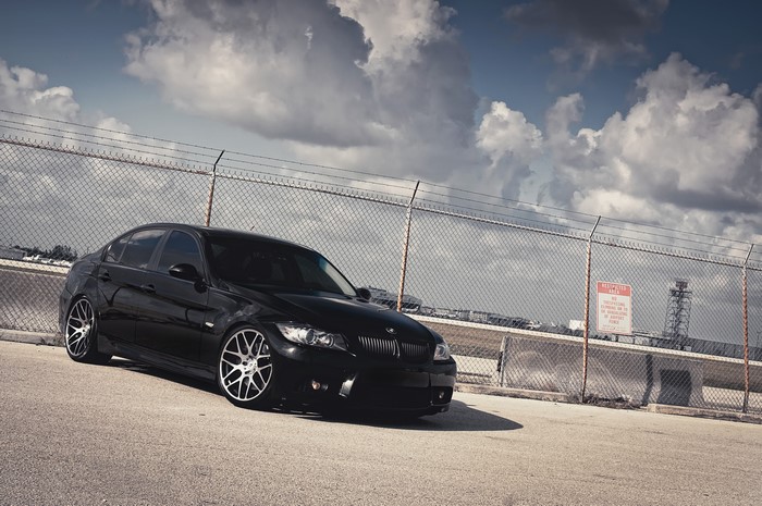 Black BMW 3 Series 335i with Clouds