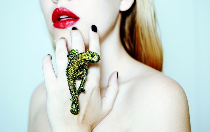Woman with red lips and chameleon ring
