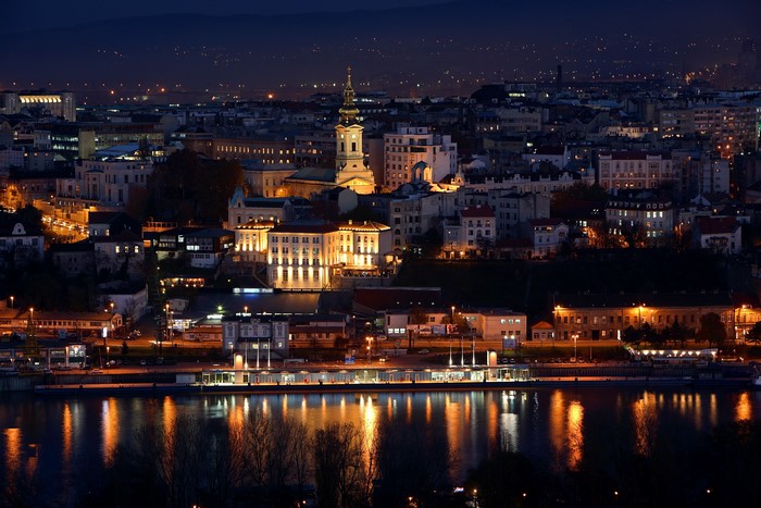 Belgrade cityscape at night with river reflection