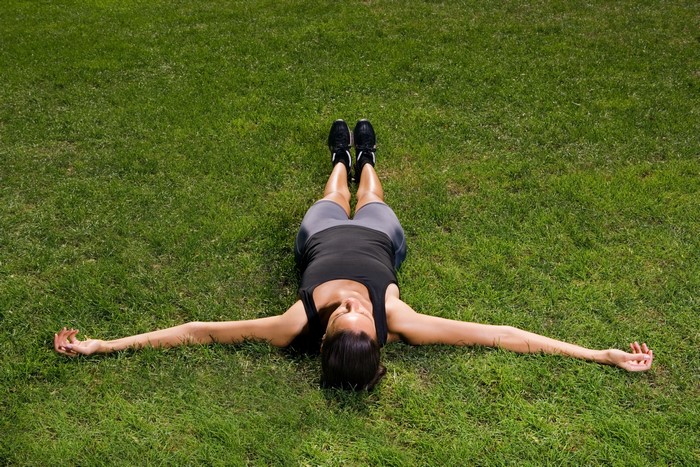Woman lying on grass