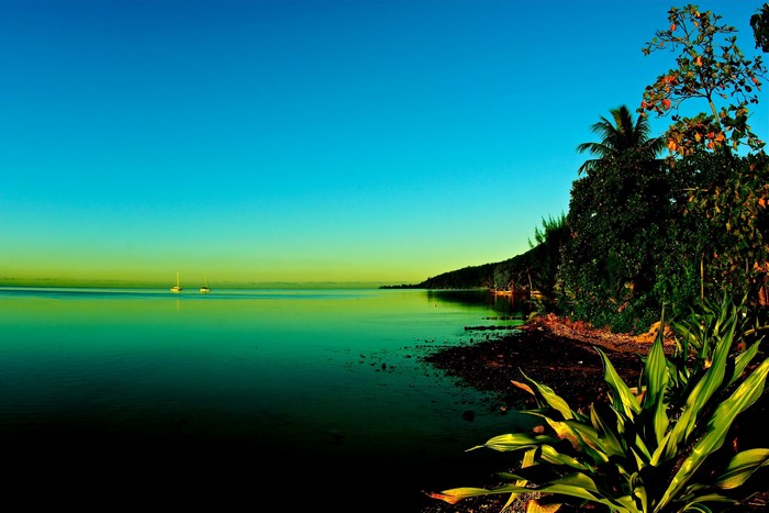 Two sailboats on the sea near Moorea, French Polynesia
