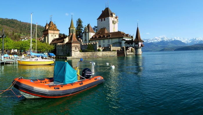 Oberhofen Castle on Lake Thun, Switzerland with boats