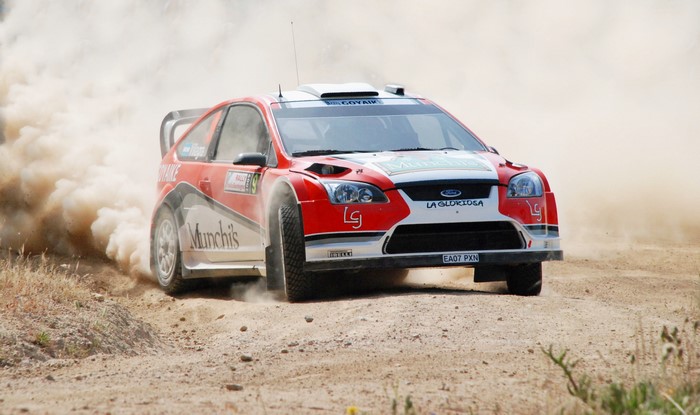 Ford Focus rally car driving on a dirt road