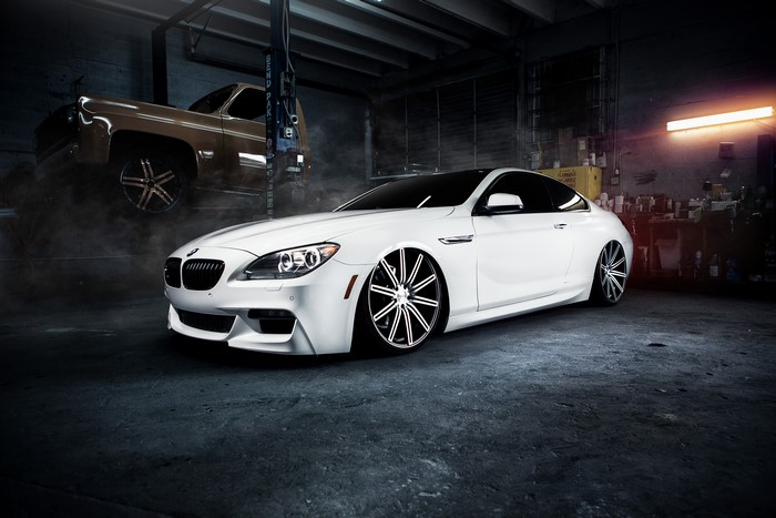 White BMW M6 in a garage
