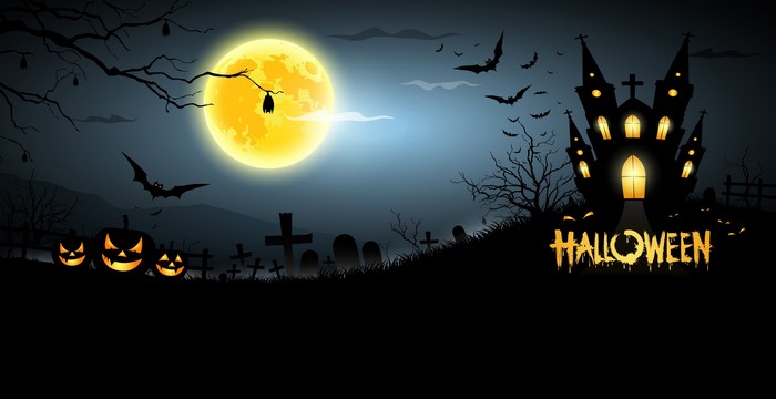 Halloween night with pumpkins, bats, and a haunted castle under the moon