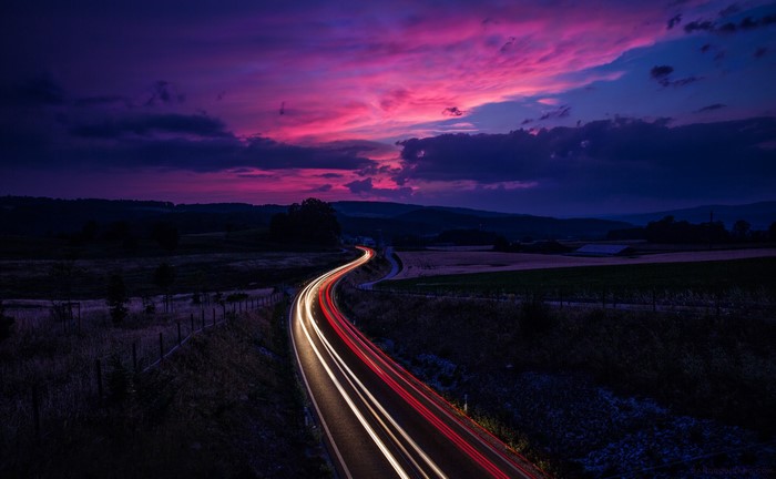 Roads in Switzerland at Night with Light Trails