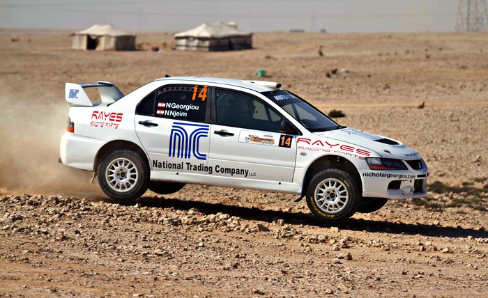 White Mitsubishi Lancer Rally Car with "RAYES RACING PARTS"