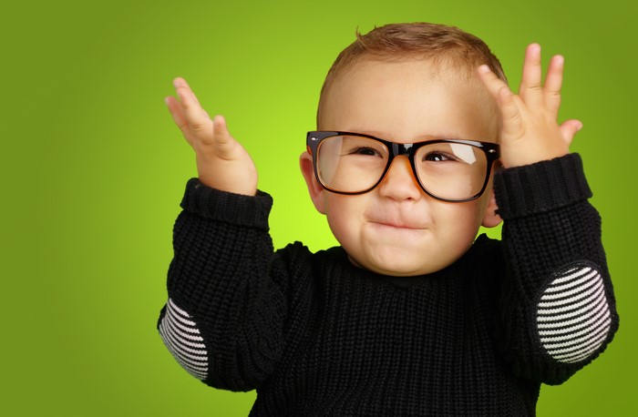Baby wearing glasses and a sweater