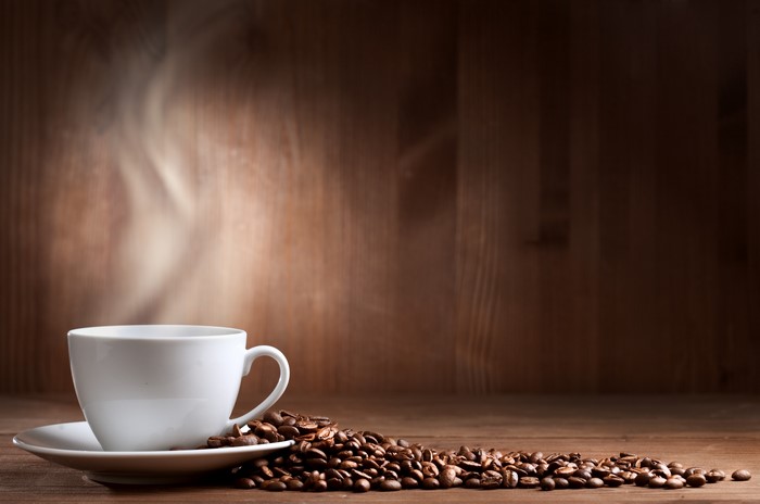 Cup of Coffee with Coffee Beans and Steam
