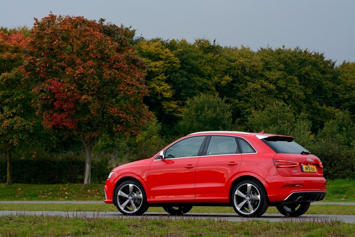 Red Audi RS Q3 parked on a road
