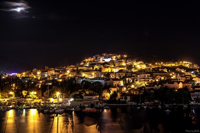 Dubrovnik at night with moon and harbor