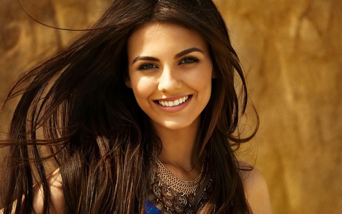 Victoria Justice smiling with long brown hair