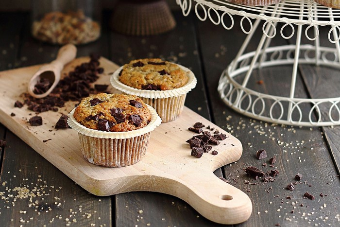 Chocolate chip muffins on a wooden board