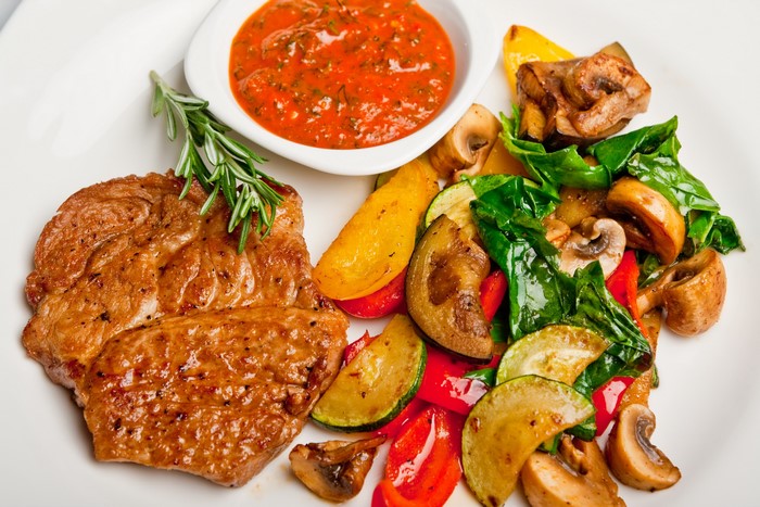Steak with roasted vegetables and tomato sauce