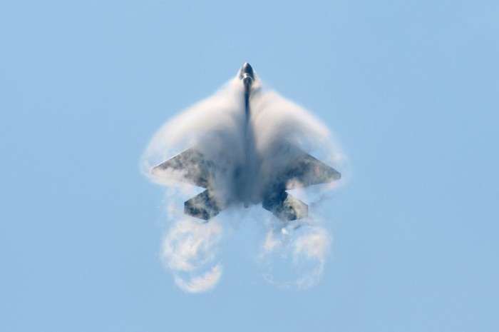 F-22 Fighter Jet Performing Maneuver