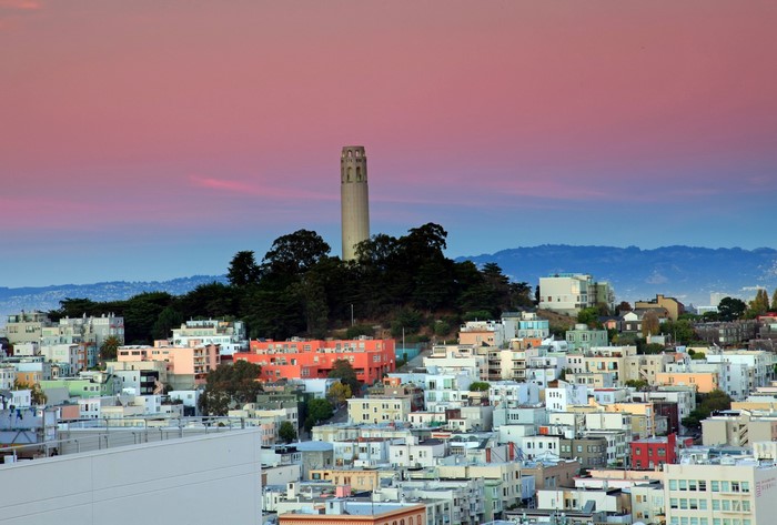 Coit Tower and San Francisco skyline at sunset