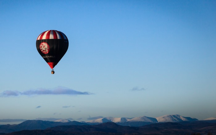 Vauxhall Hot Air Balloon Over Snowy Mountains