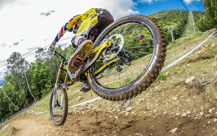 Mountain biker jumping on a dirt track