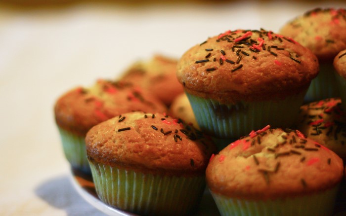Muffins with sprinkles on a plate