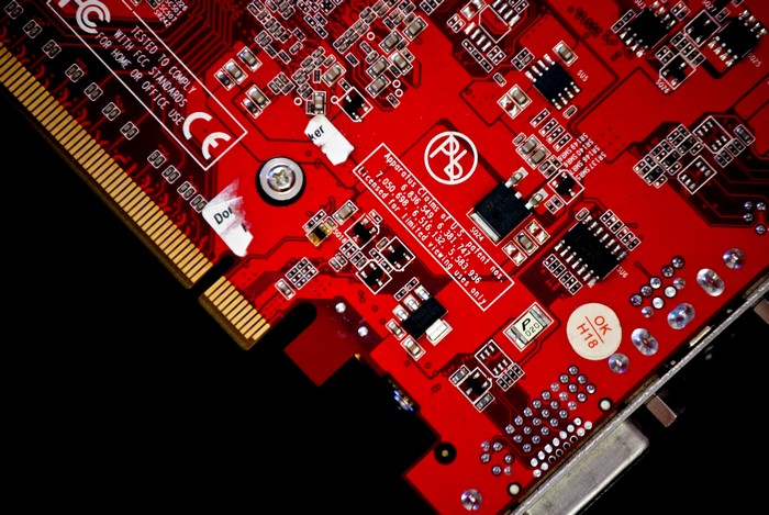 Close-up of a red circuit board with components
