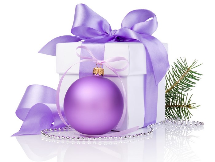Christmas gift with purple ornament and pine branch