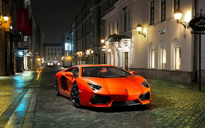 Orange Lamborghini Aventador LP700-4 on a European Street at Night
