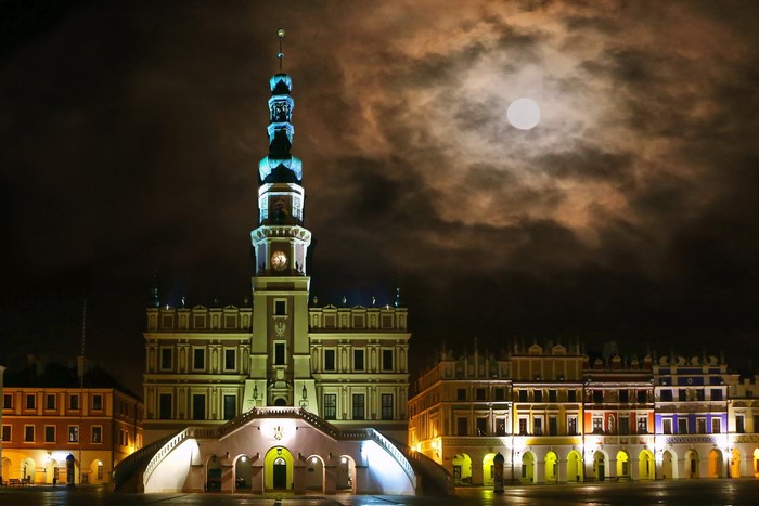 Zamosc Town Hall at night with moon