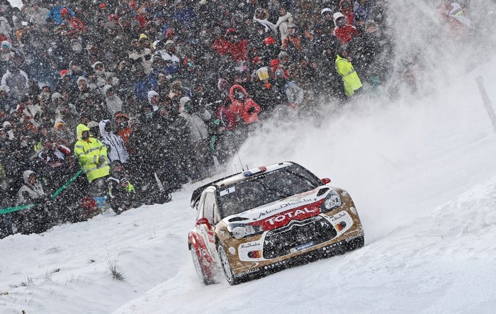 Citroen DS3 rally car in snow with spectators