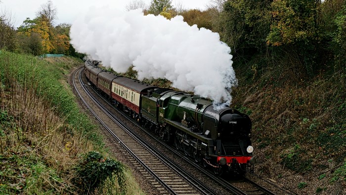 Steam Locomotive with Passenger Cars on a Curved Track