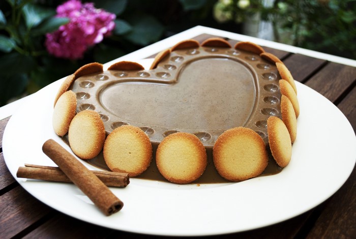 Heart-shaped chocolate dessert with cookies and cinnamon