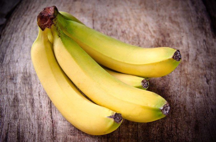 Bunch of Bananas on Wooden Surface