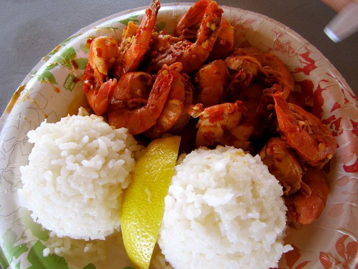 Shrimp with rice and lemon on a plate