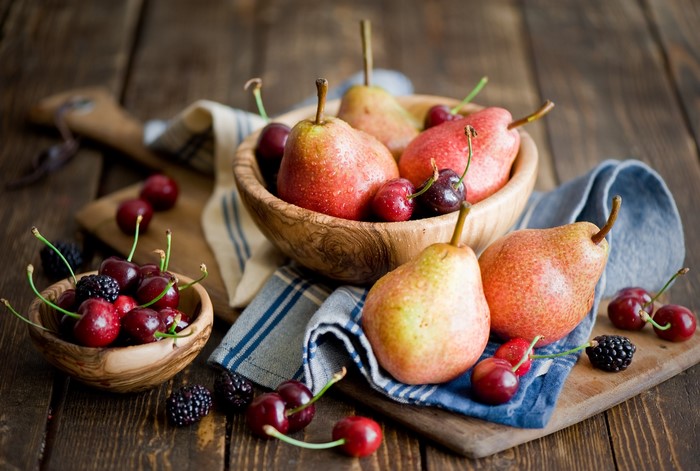 Pears and Cherries in Wooden Bowls