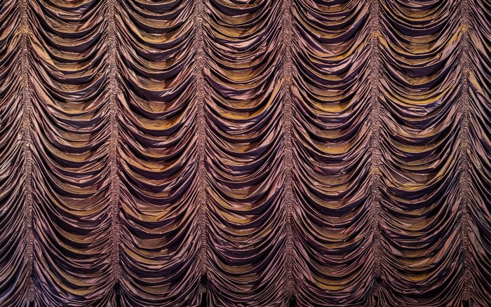 Drapery fabric with vertical pleats