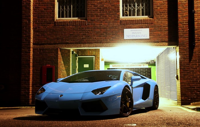 Light Blue Lamborghini Aventador LP700-4 parked at night