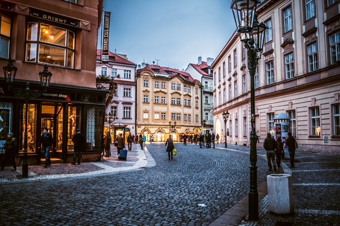 Prague street with historic buildings and street lights