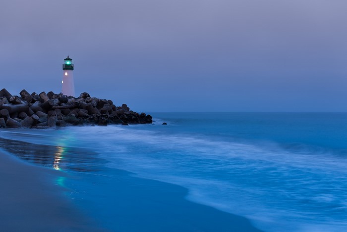 Lighthouse on a breakwater at dusk