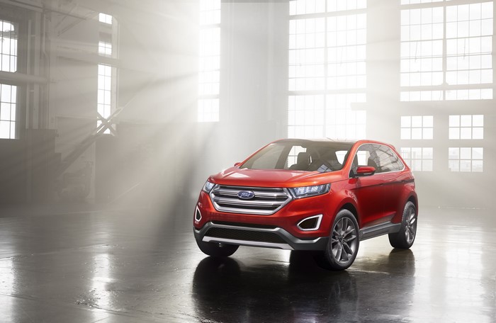 Red Ford Edge concept car in studio with light rays