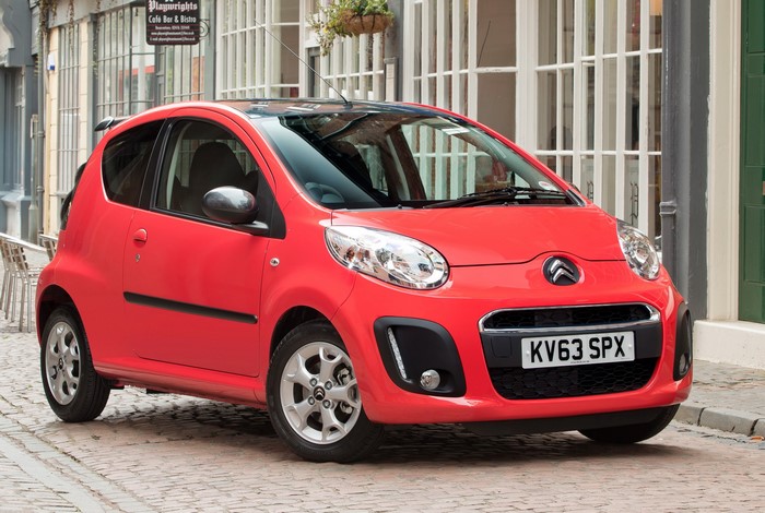 Red Citroen C1 Platinum parked on cobblestone street