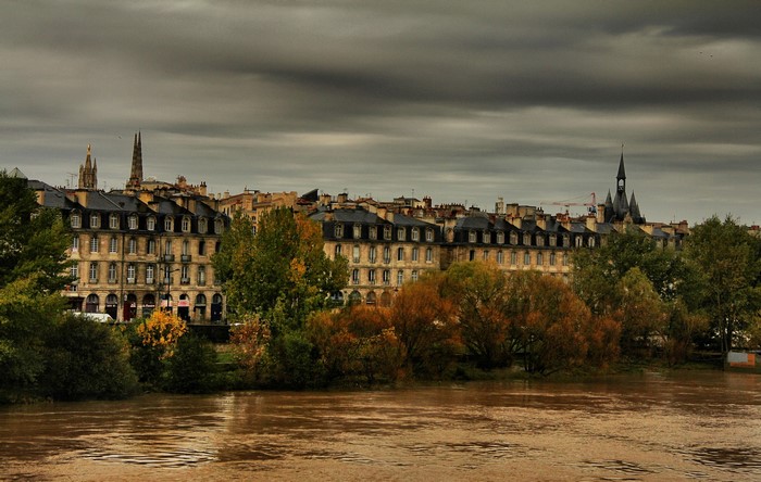 Bordeaux cityscape with river and cloudy sky