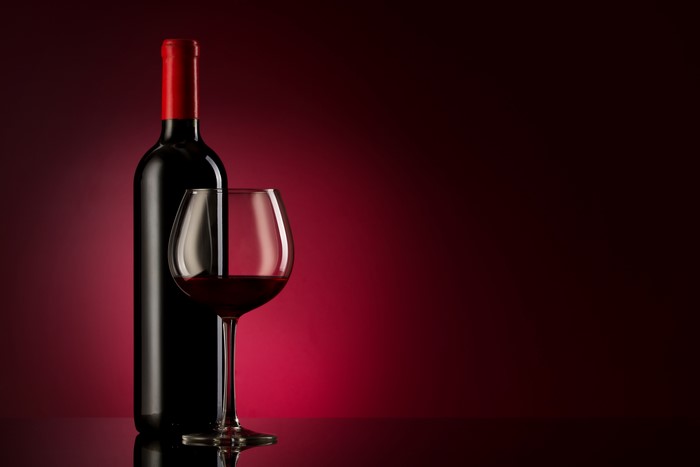 Bottle of Red Wine and a Glass