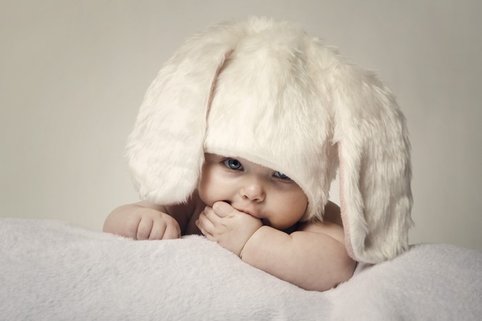 Baby wearing a fluffy bunny hat