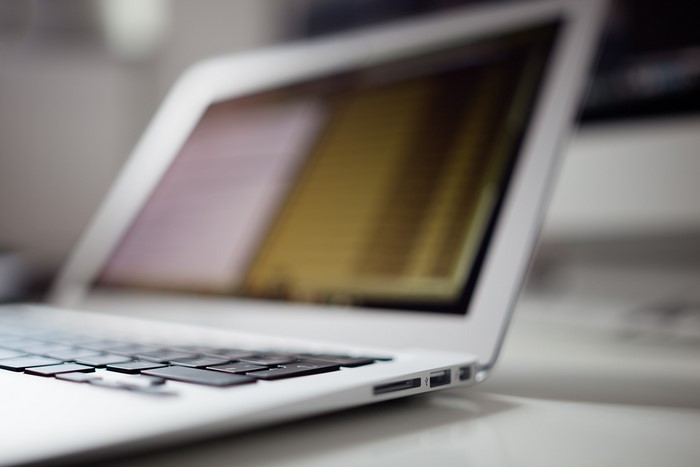 Close-up of a silver laptop keyboard and ports